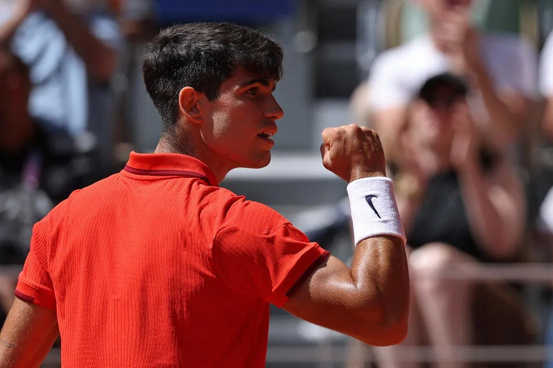 FILE PHOTO: Paris 2024 Olympics - Tennis - Men's Singles Gold Medal Match - Roland-Garros Stadium, Paris, France - August 04, 2024. Carlos Alcaraz of Spain reacts during his match against Novak Djokovic of Serbia. REUTERS/Claudia Greco/File Photo