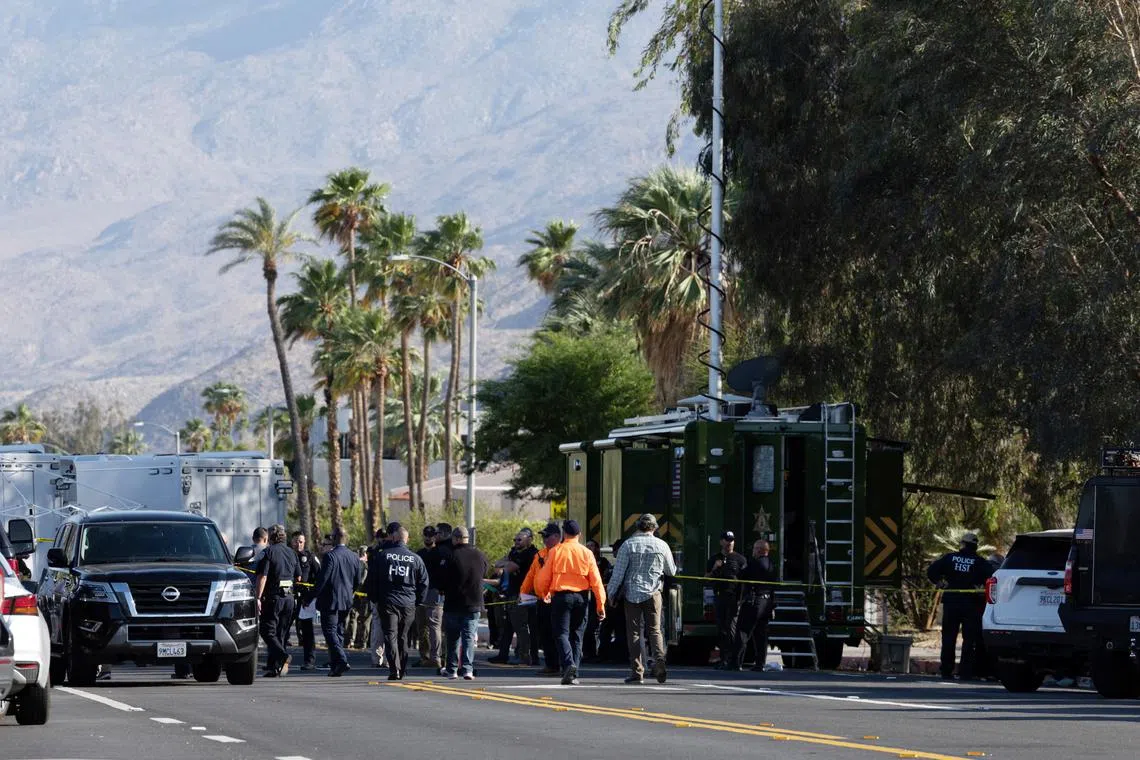 Investigators gather after a bomb exploded near a reproductive health facility in Palm Springs, California, U.S. May 17, 2025.   REUTERS/Amanda Villegas/File Photo