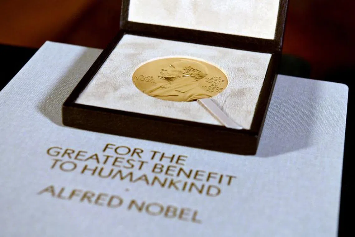FILE PHOTO: The Nobel Prize medal, presented to Charles M. Rice in Physiology or Medicine, is seen after Swedish Consul General Annika Rembe presented it to him at her residence in New York City, U.S. December 8, 2020. Angela Weiss/Pool via REUTERS/File Photo