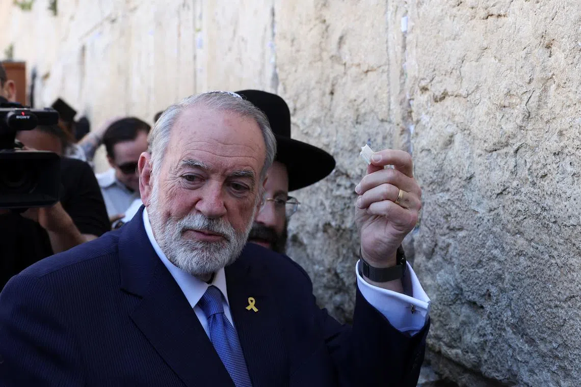 FILE PHOTO: U.S. Ambassador to Israel Mike Huckabee visits the Western Wall, Judaism's holiest prayer site, in Jerusalem's Old City, April 18, 2025. REUTERS/Ronen Zvulun/File Photo