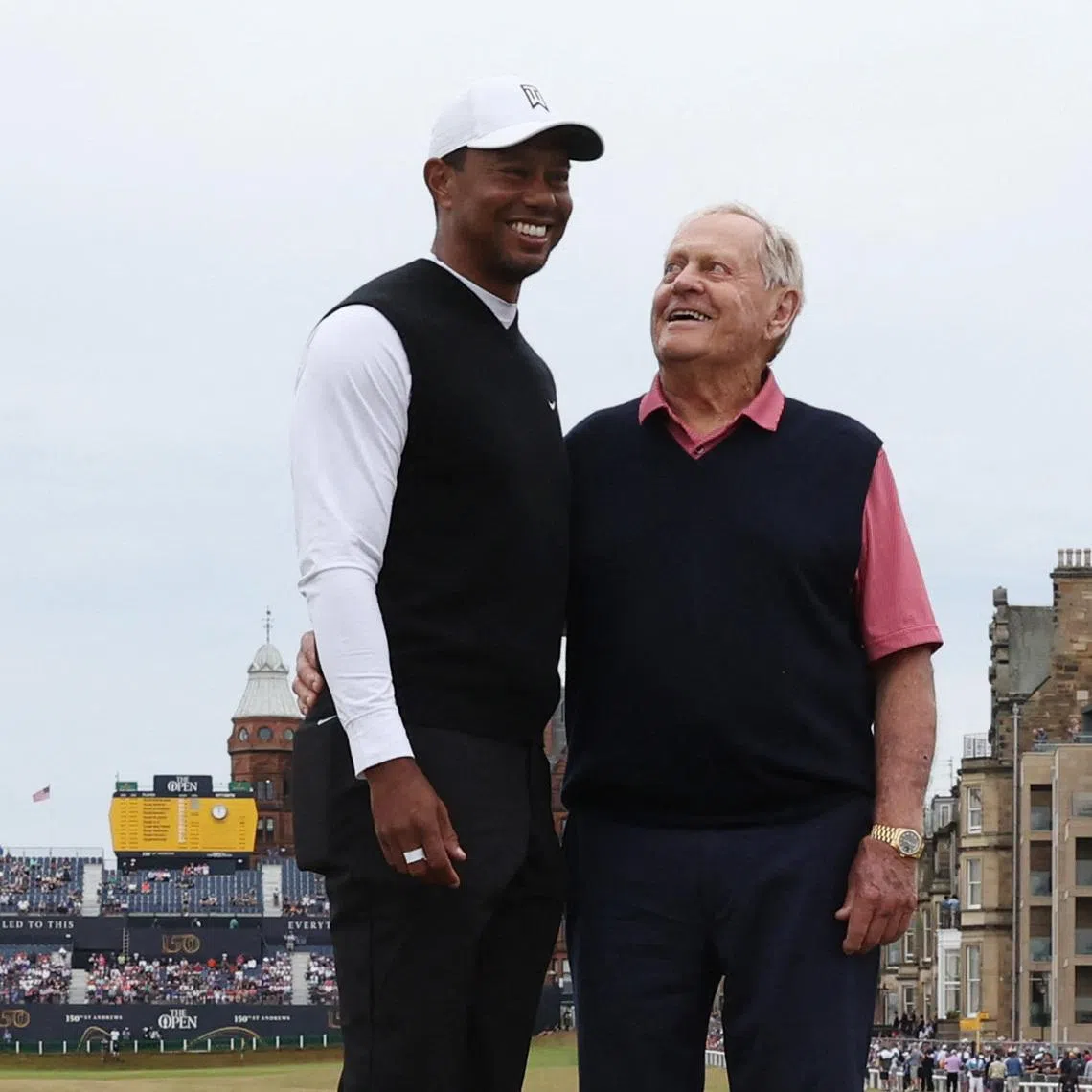 Golf - 150th Open Championship - St Andrews, Scotland, Britain - July 11, 2022 Former golfer Jack Nicklaus poses with Team Woods' Tiger Woods of the U.S. on the Swilcan Bridge during the Celebration of Champions four hole tournament REUTERS/Paul Childs