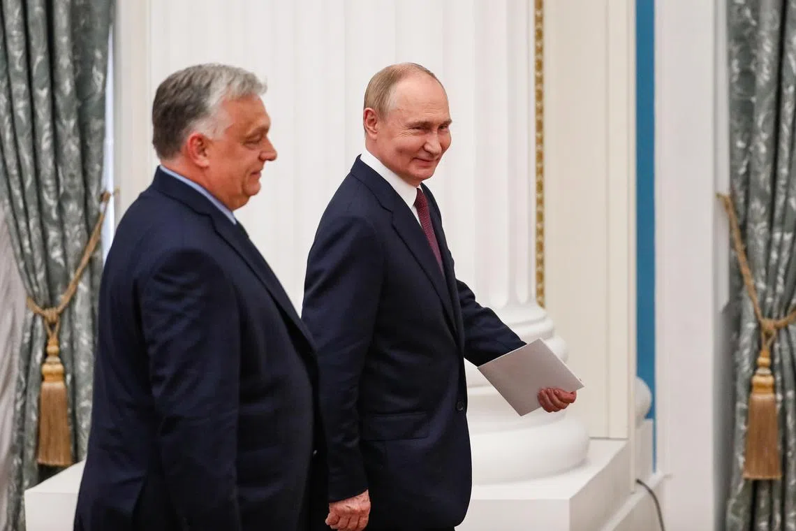 Hungarian Prime Minister Viktor Orban (left) visiting Russian President Vladimir Putin (right) in Moscow, on July 5.