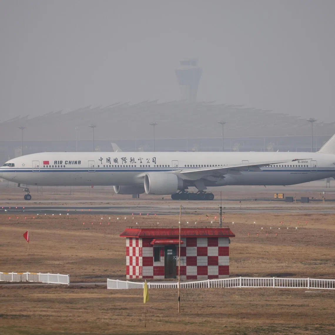 An Air China passenger airplane lands at Beijing Capital International Airport in China, on March 26, 2026. The airline said it will raise its fuel surcharge on domestic flights.