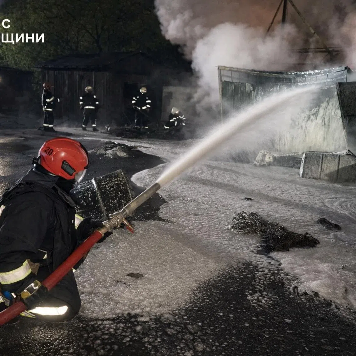 Firefighters work at a compound of a port on the Danube river which was hit during overnight Russian drone strikes, amid Russia's attack on Ukraine, in Odesa region, Ukraine April 17, 2026. Picture taken with a mobile phone. Press service of the State Emergency Service of Ukraine in Odesa region/Handout via REUTERS