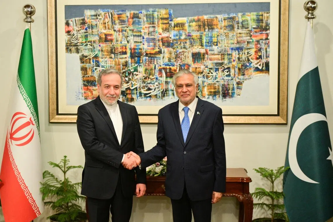 Pakistan's Foreign Minister Ishaq Dar shakes hands with Iran's Foreign Minister Abbas Araghchi upon his arrival in Islamabad, Pakistan May 5, 2025. Ministry of Foreign Affairs (MoFA)/Handout via REUTERS