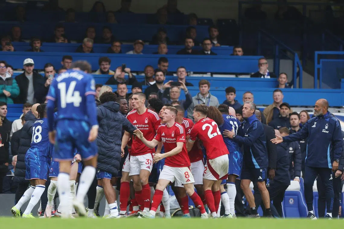 Nottingham Forest (red) and Chelsea players clashing during their English Premier League match in London on Oct 6, 2024.