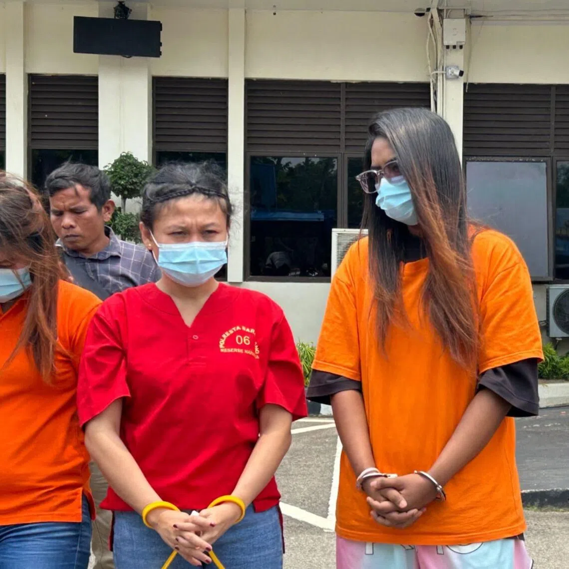 The Indonesian authorities reportedly became suspicious about the Singaporean woman (centre) due to her awkward gait.