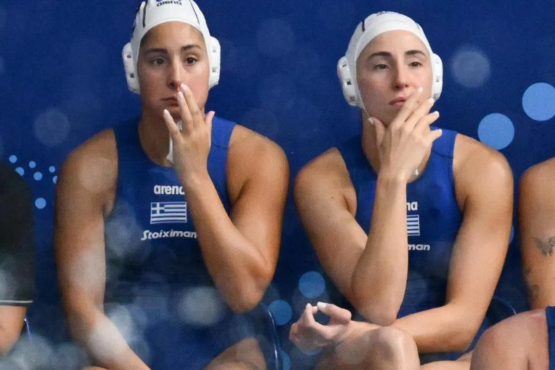 Vasiliki Plevritou (10) and her sister Eleftheria (2) in Greece's 25-15 win over Japan in their final Group C game at the World Aquatic Championships at the OCBC Aquatic Centre on July 15.