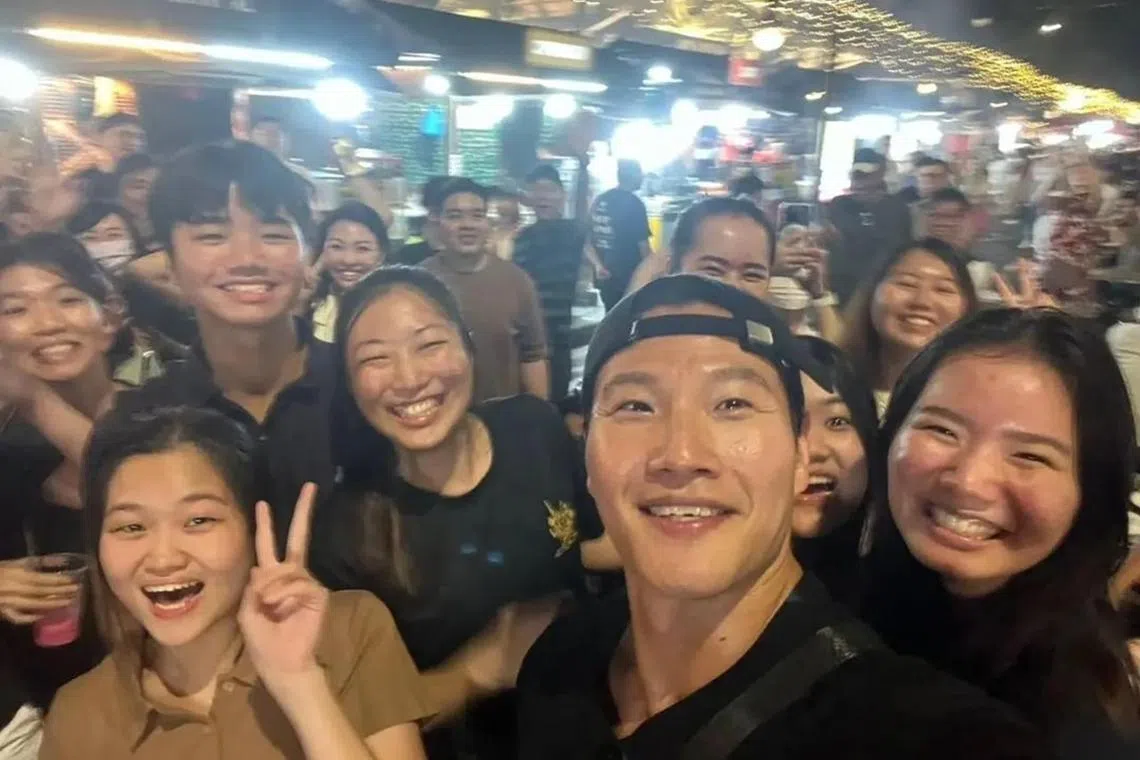 Kim Jong-kook from popular South Korean variety series Running Man takes a wefie with fans at Lau Pa Sat.