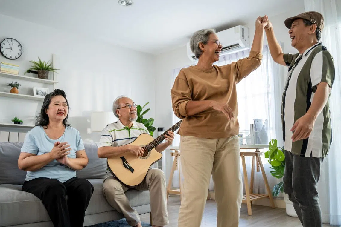 Elderly Asians singing and dancing, enjoying life