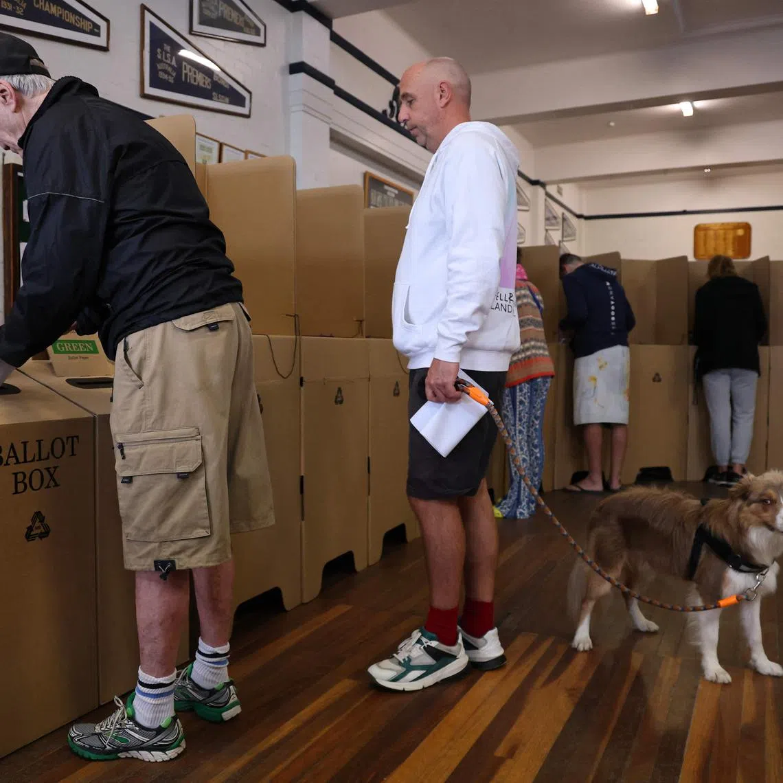 People cast their ballots at a polling centre for Australia's general election at the Bondi Surf Bathers Life Saving Club in Sydney on May 3, 2025.  
