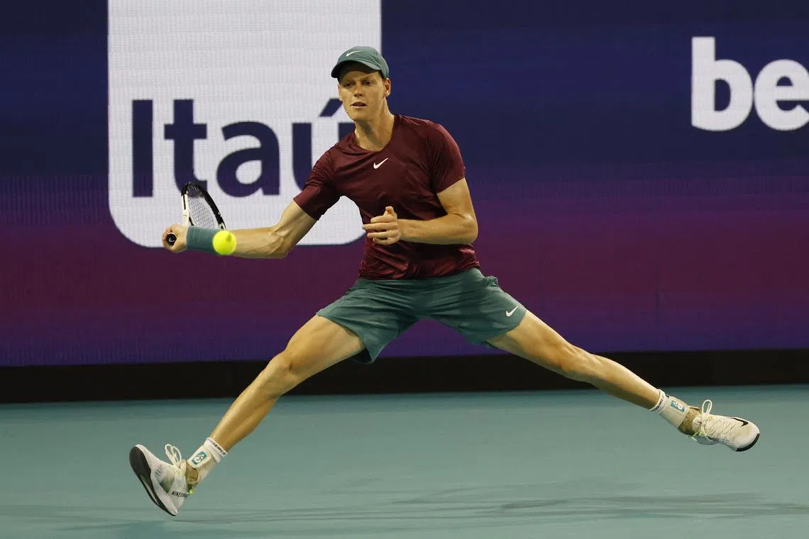 Jannik Sinner reaches for a forehand against Carlos Alcaraz in their Miami Open semi-final.