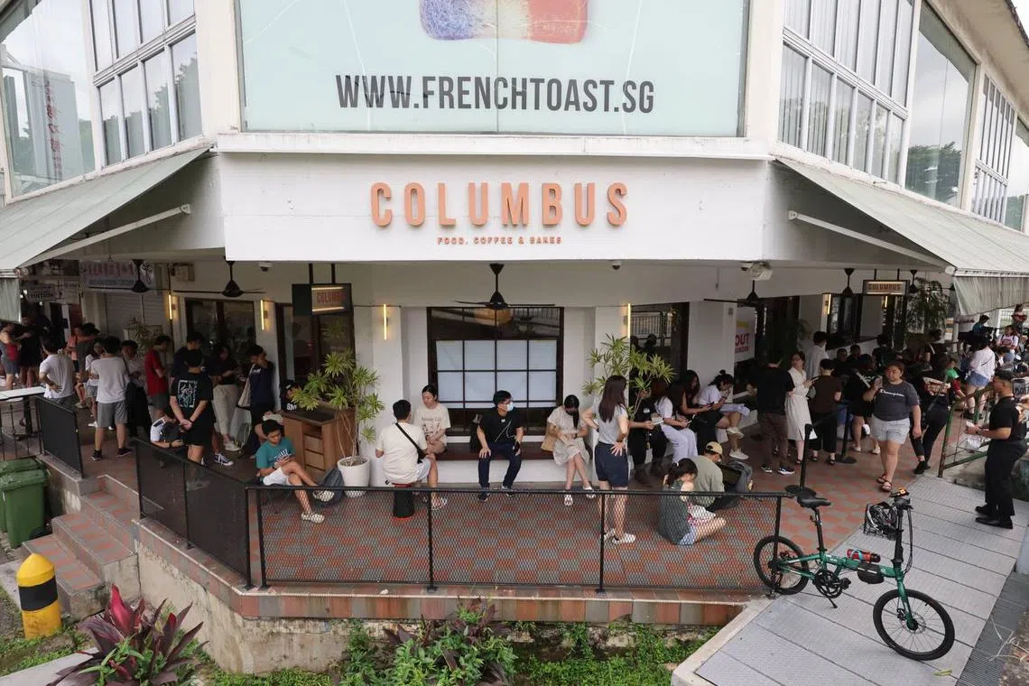 Customers wait in line at Columbus Cafe Co., at Upper Thomson, where the pop-up is held, on May 31.