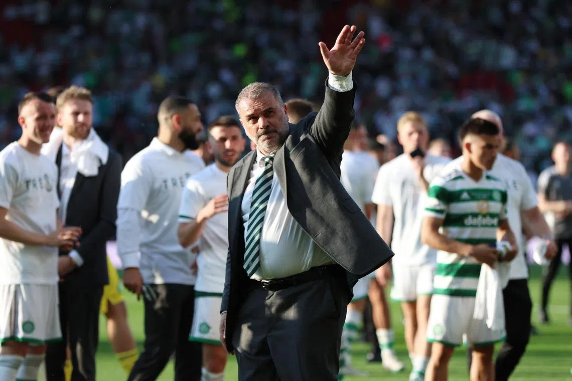 Celtic manager Ange Postecoglou acknowledges fans after winning the Scottish Cup.