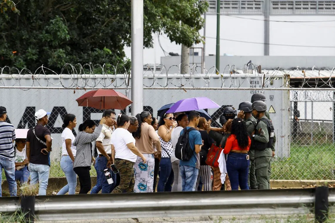 FILE PHOTO: Family members enquire about their loved ones who were detained during protests over a contested July presidential election, in Tocuyito, Venezuela December 16, 2024. REUTERS/Juan Carlos Hernandez/File Photo