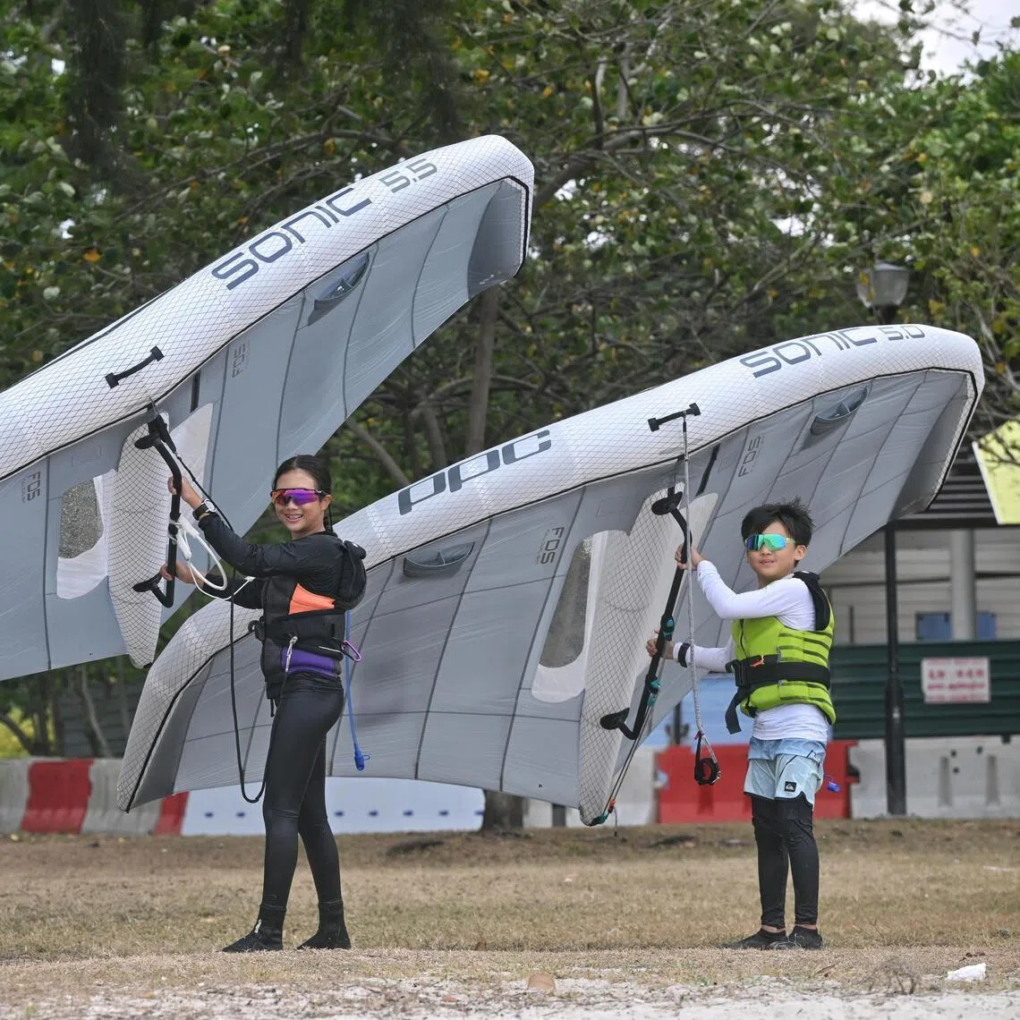 Victoria Chew (left), 13, and Mason Lau, nine, training at Changi Beach on Jan 21.