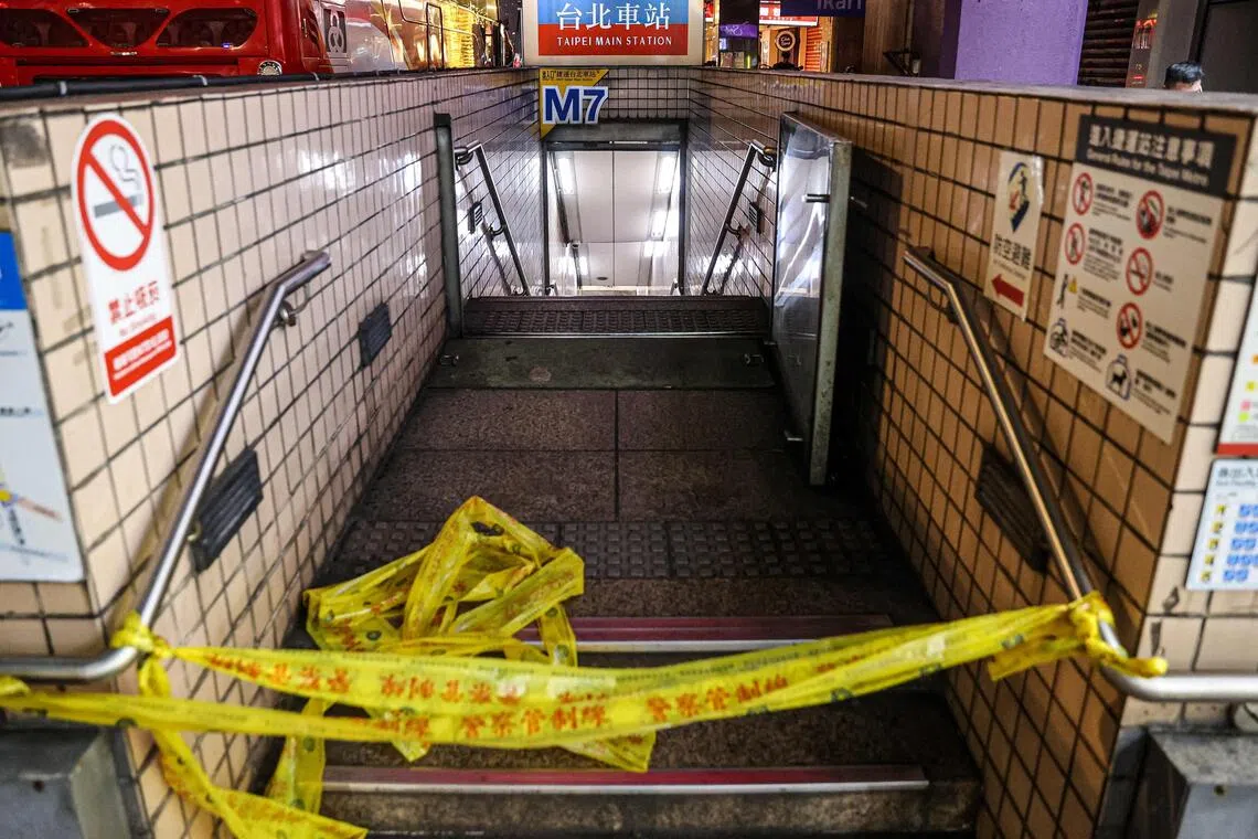 This picture taken and released by Taiwan's Central News Agency (CNA) on December 19, 2025 shows one of the entrances to Taipei Main Station being cordoned off as it is temporarily closed after an attack at the station. Attacks at metro stations in Taipei on December 19 involving smoke bombs and stabbing killed at least two people, a fire department official told AFP, adding that the suspect was also dead. (Photo by CHENG CHING-YUAN / CNA / AFP) / Taiwan OUT - Macau OUT - China OUT / HONG KONG OUT
RESTRICTED TO EDITORIAL USE - MANDATORY CREDIT "AFP PHOTO / CNA Photo" - NO MARKETING - NO ADVERTISING CAMPAIGNS - DISTRIBUTED AS A SERVICE TO CLIENTS