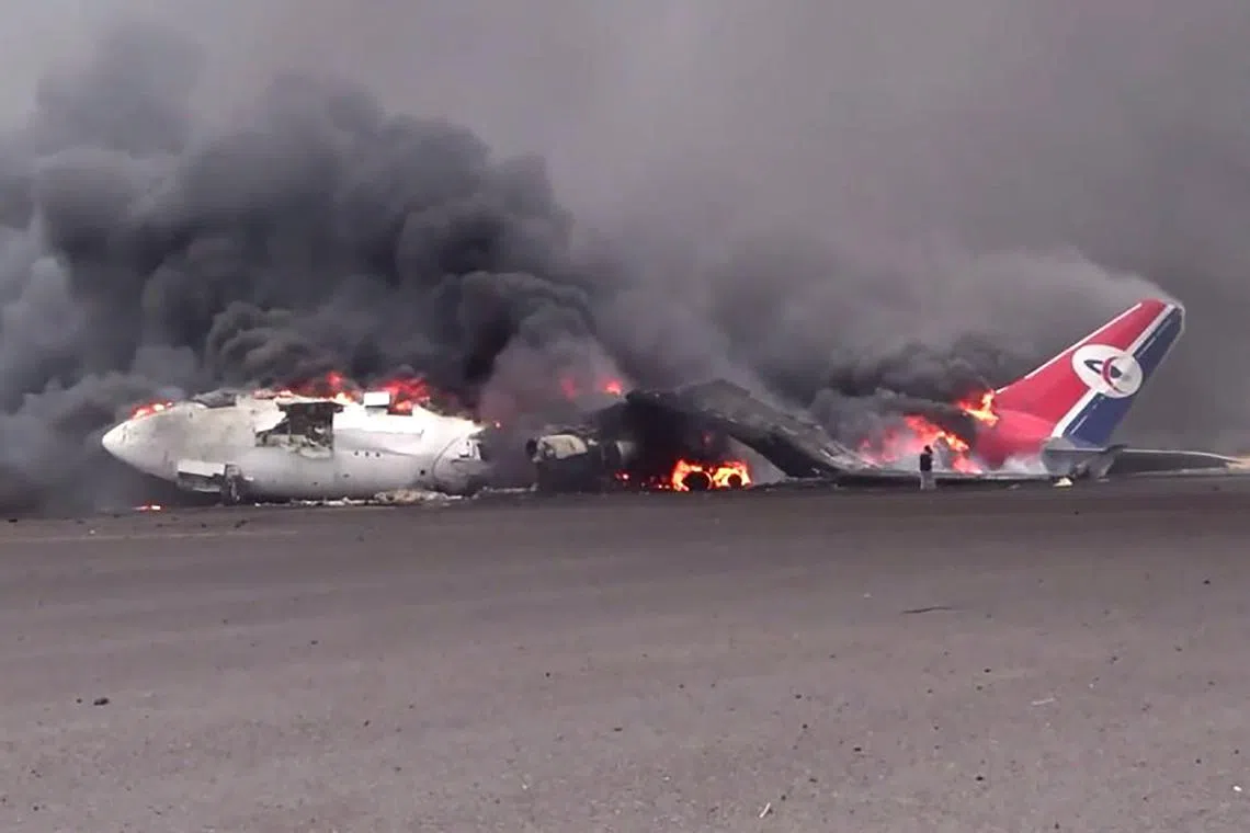 A burning airplane at Sanaa international airport after Israel's military warplanes struck Yemen's rebel-held capital Sanaa, on May 6, 2025. 
