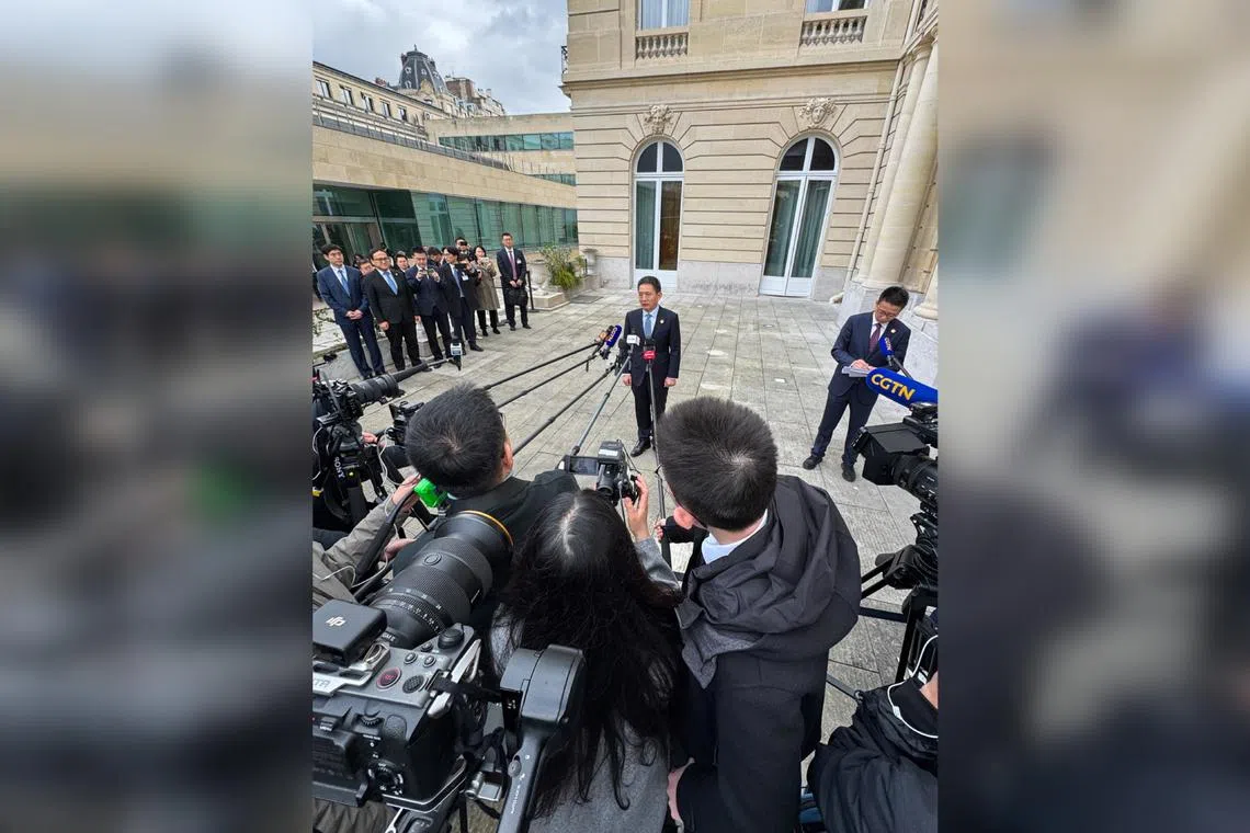 China's chief trade negotiator Li Chenggang (centre) speaks to the media, after two days of meetings with US counterparts, in Paris, France on March 16.