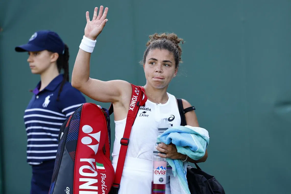 Italy's Jasmine Paolini leaves the court after losing her second-round match.