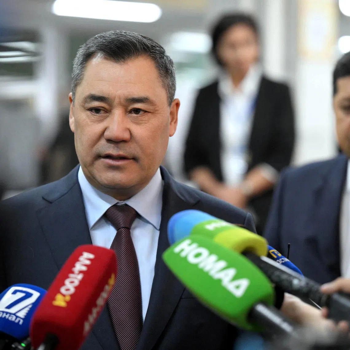 Kyrgyz President Sadyr Japarov speaks to the media as he visits a polling station during the snap parliamentary election in Bishkek, Kyrgyzstan November 30, 2025. Kyrgyz Presidential Press Service/Handout via REUTERS