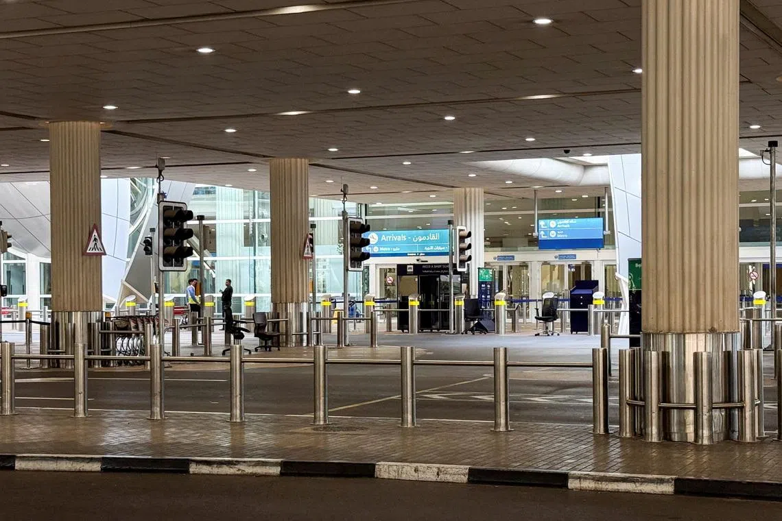 An empty arrivals area at the Dubai International Airport, following the United States and Israel strikes on Iran, in Dubai, United Arab Emirates, March 2, 2026. Picture taken using a mobile phone. REUTERS/Raghed Waked