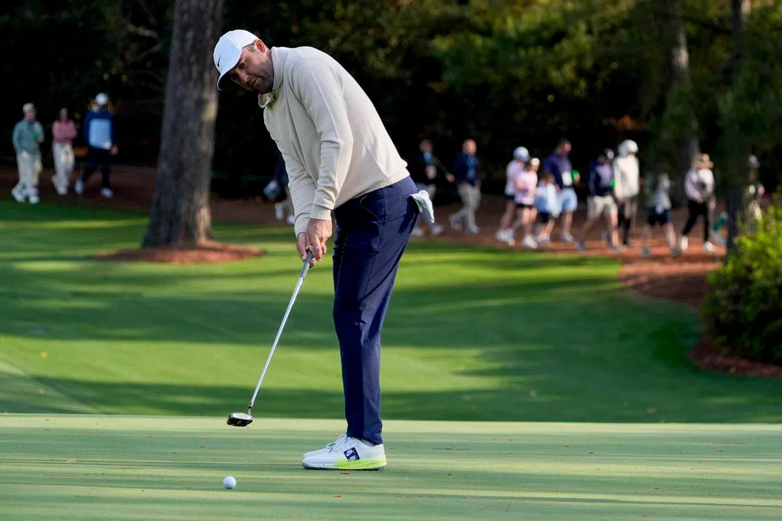 Apr 8, 2026; Augusta, Georgia, USA; Scottie Scheffler putts on the 10th green during a practice round for the Masters Tournament at Augusta National Golf Club. Mandatory Credit: Katie Goodale-Imagn Images
