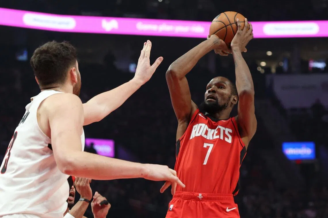 Houston Rockets' Kevin Durant (right) shooting the ball over Portland's Donovan Clingan in the Trail Blazers' 103-102 win on Jan 7.