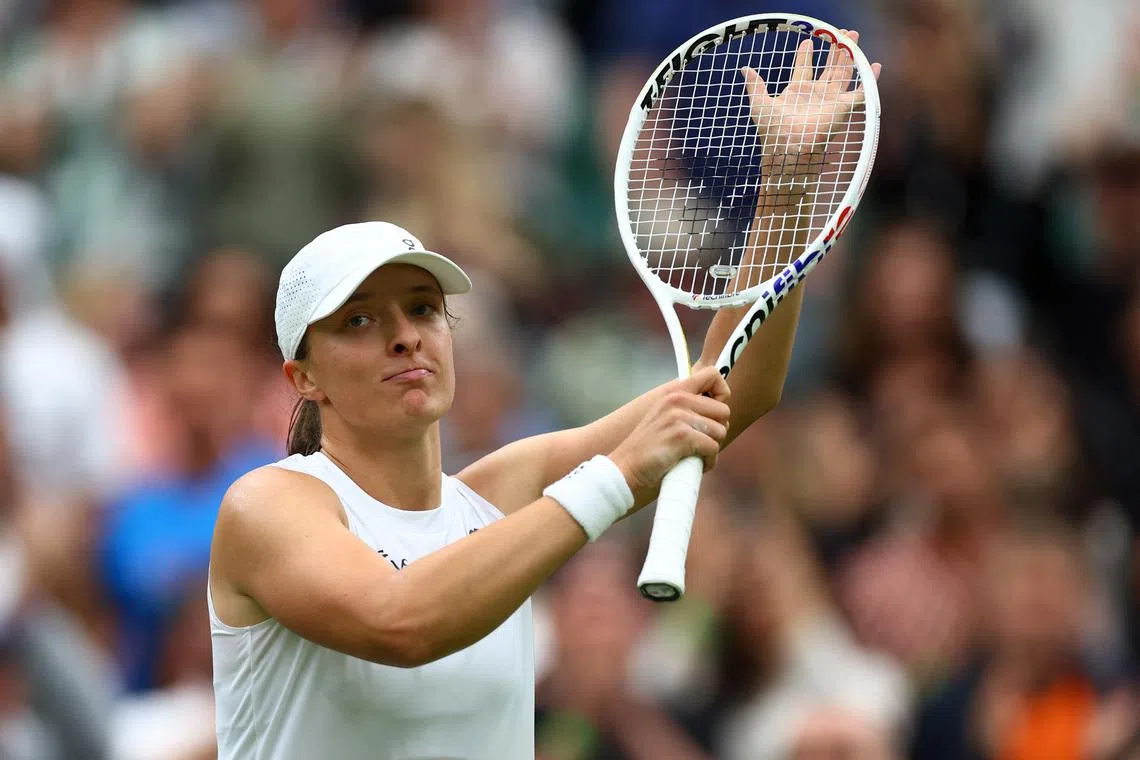 Tennis - Wimbledon - All England Lawn Tennis and Croquet Club, London, Britain - July 2, 2024 Poland's Iga Swiatek celebrates winning her first round match against Sofia Kenin of the U.S. REUTERS/Hannah Mckay