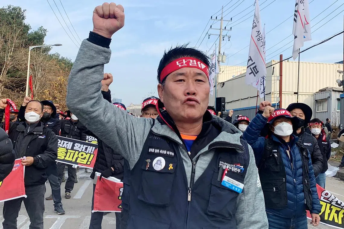 Unionized truckers shout slogans during their rally as they kick off their strike in front of transport hub Uiwang, south of Seoul, South Korea November 24, 2022. REUTERS/Ju-min Park