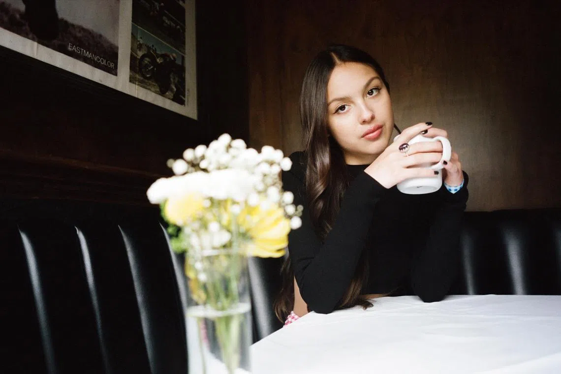 Olivia Rodrigo in Los Angeles, July 25, 2023. After the blockbuster success of her debut LP, ÒSour,Ó and its smash ÒDrivers License,Ó the 20-year-old cranks up the volume and digs deep for its powerful follow-up, ÒGuts.Ó (Chantal Anderson/The New York Times)