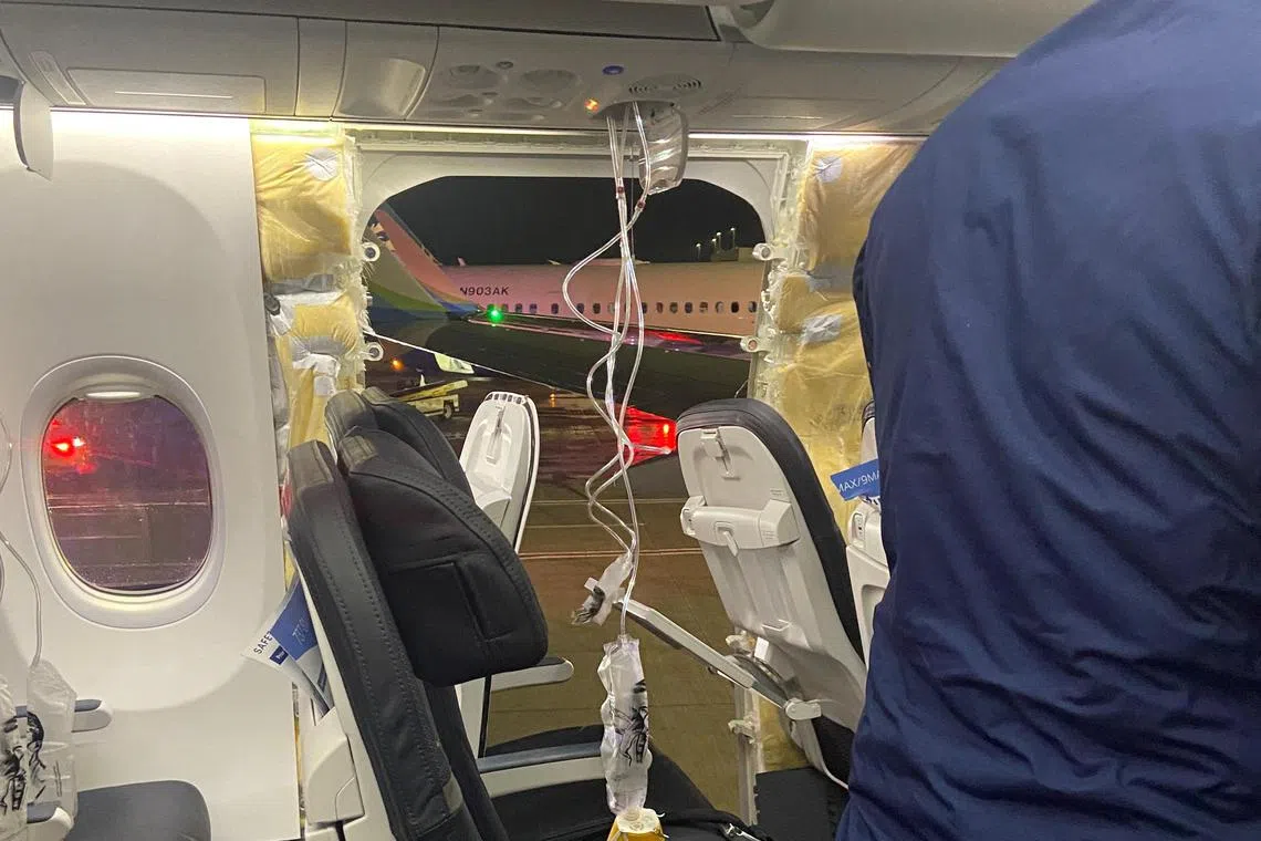 Passenger oxygen masks hang from the roof next to a missing window and a portion of a side wall of an Alaska Airlines Flight 1282, which had been bound for Ontario, California and suffered depressurization soon after departing, in Portland, Oregon, U.S., January 5, 2024 in this picture obtained from social media. Kyle Rinker via X/via REUTERS  THIS IMAGE HAS BEEN SUPPLIED BY A THIRD PARTY. MANDATORY CREDIT. NO RESALES. NO ARCHIVES.