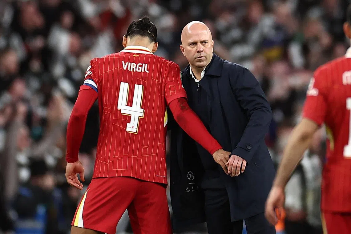 Liverpool manager Arne Slot and captain Virgil van Dijk after the League Cup final loss to Newcastle United. The Reds will now turn their attention to the Premier League when they host city rivals Everton. 