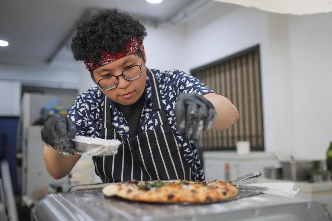 Ngoh preparing a truffle cream mushroom and crispy kale pizza at The Chop Community on Sept 19.