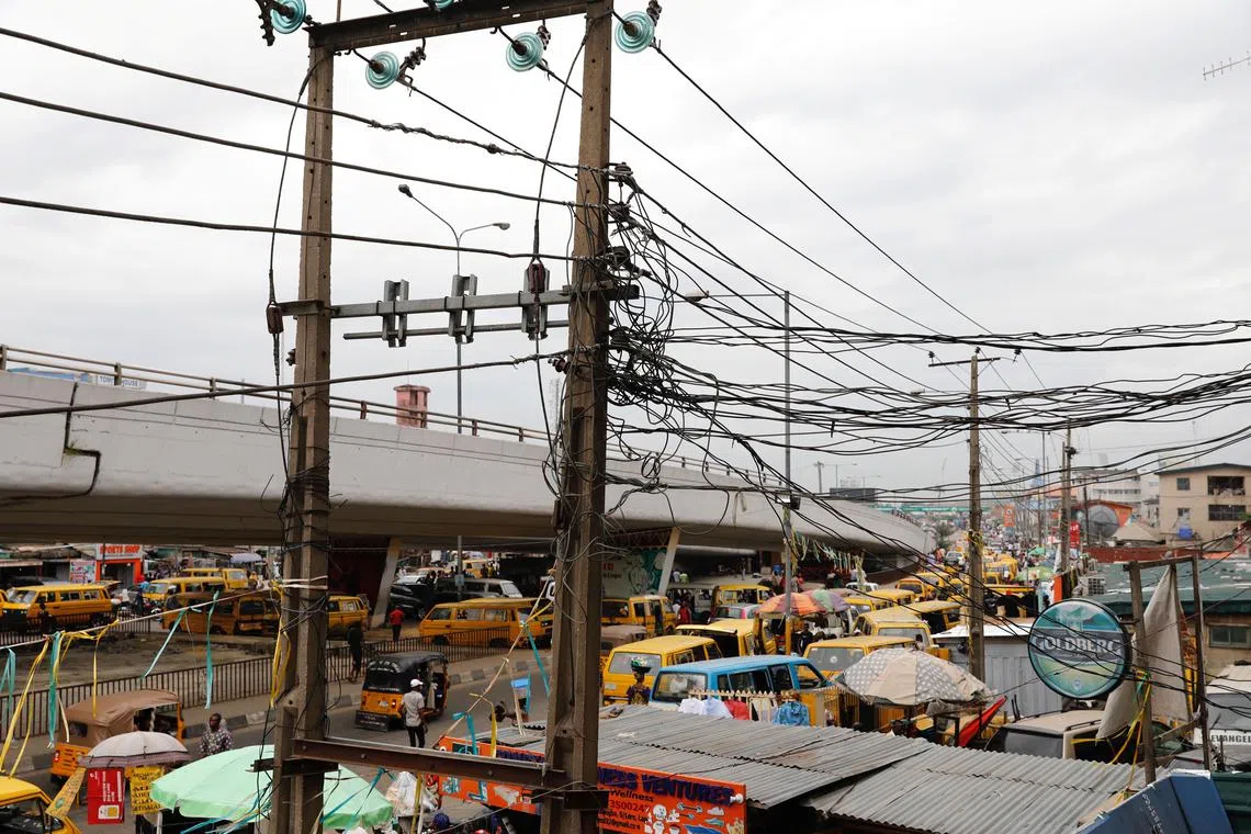 FILE PHOTO: Electric wires are pictured in Ojuelegba district in Nigeria's commercial capital Lagos, Nigeria June 18, 2018. REUTERS/Akintunde Akinleye/File Photo