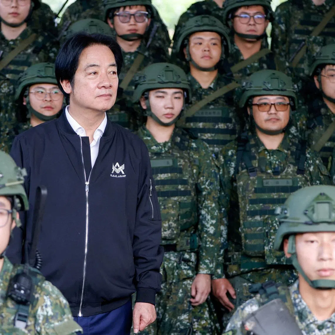 FILE PHOTO: Taiwan President Lai Ching-te poses for photo after inspecting reservists operating Taiwan made Hummer 2 Drone during a training session at Loung Te Industrial Parks Service Center in Yilan, Taiwan December 2, 2025. REUTERS/Ann Wang/File Photo