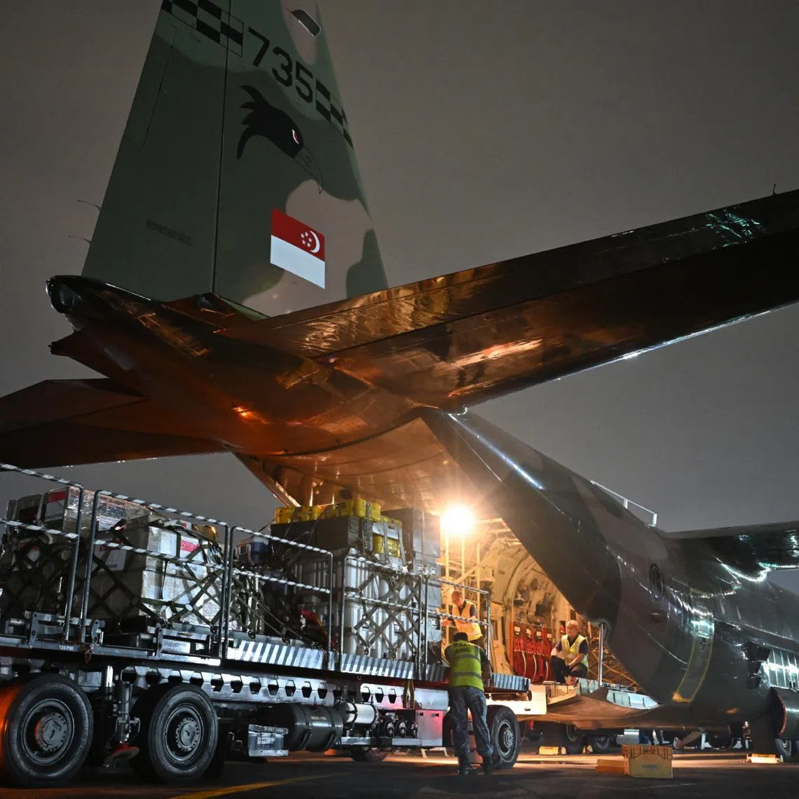 Loading of Singapore's humanitarian aid for Gaza onto the RSAF's C-130.