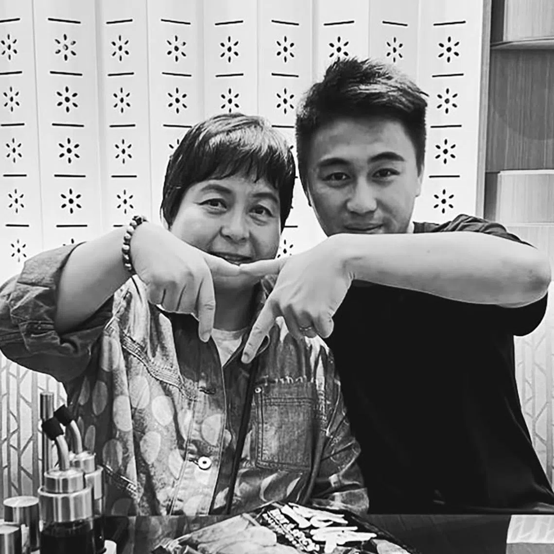 In a black-and-white photo Mr Mario Ho shared on Instagram on April 12, he and Ms Ho are seen forming a heart shape with their hands.