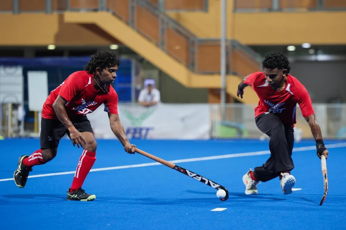 Midfielders Dineshraj Naidu (left) and his brother, co-captain Hariraj Naidu during a training session at Sengkang Hockey Stadium on April 30.