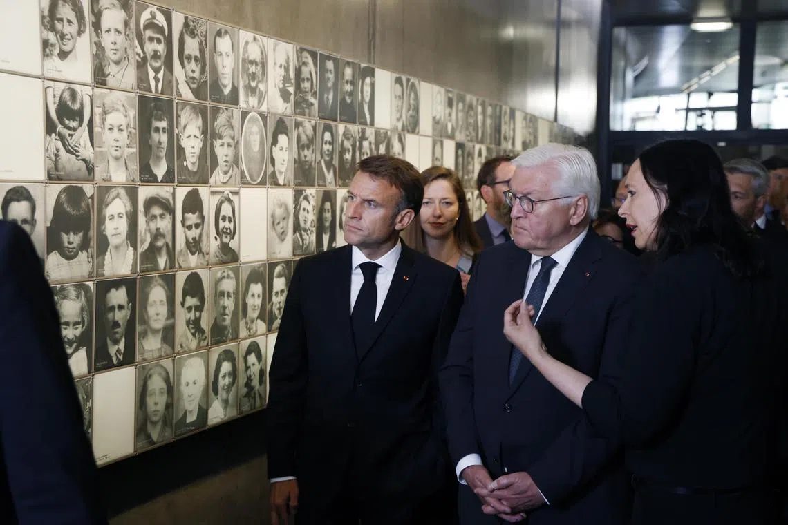 French President Emmanuel Macron (left) and German President Frank-Walter Steinmeier (right) visiting a World War II memorial centre in south-western France on June 10. 