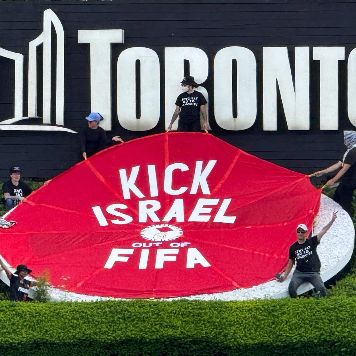 Protesters hold a banner reading \"Kick Israel Out of FIFA\", ahead of Canada's World Cup match against Bosnia and Herzegovina in Toronto, Ontario, Canada, June 12, 2026. REUTERS/Kyaw Soe Oo