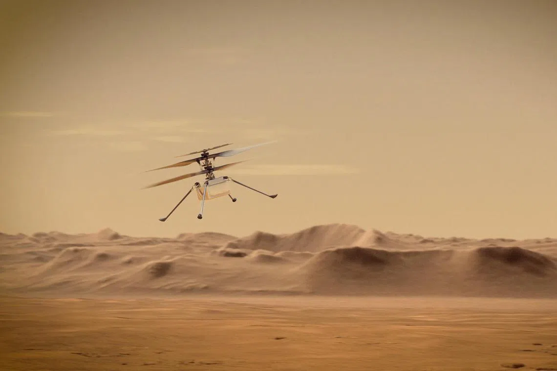 An artist’s impression of Nasa’s Mars helicopter, Ingenuity, flying through the Red Planet’s skies. 
