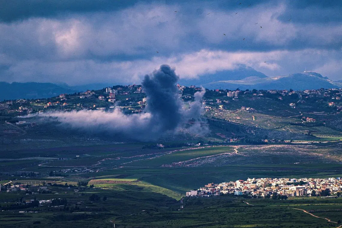 Smoke rises on the Lebanese side of the border between Israel and Lebanon after an Israeli strike, as seen from northern Israel, April 10, 2024. REUTERS/Ayal Margolin/File Photo