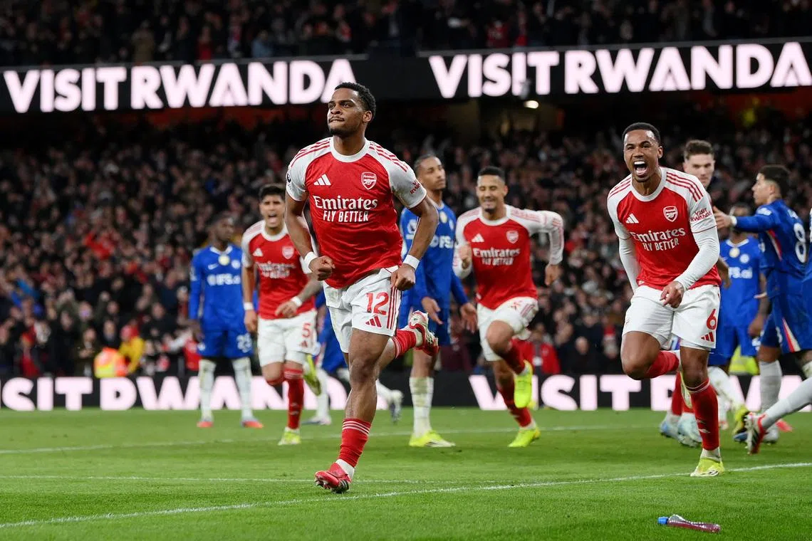 Soccer Football - Premier League - Arsenal v Chelsea - Emirates Stadium, London, Britain - March 1, 2026 Arsenal's Jurrien Timber celebrates scoring their second goal with Gabriel Magalhaes REUTERS/Jaimi Joy