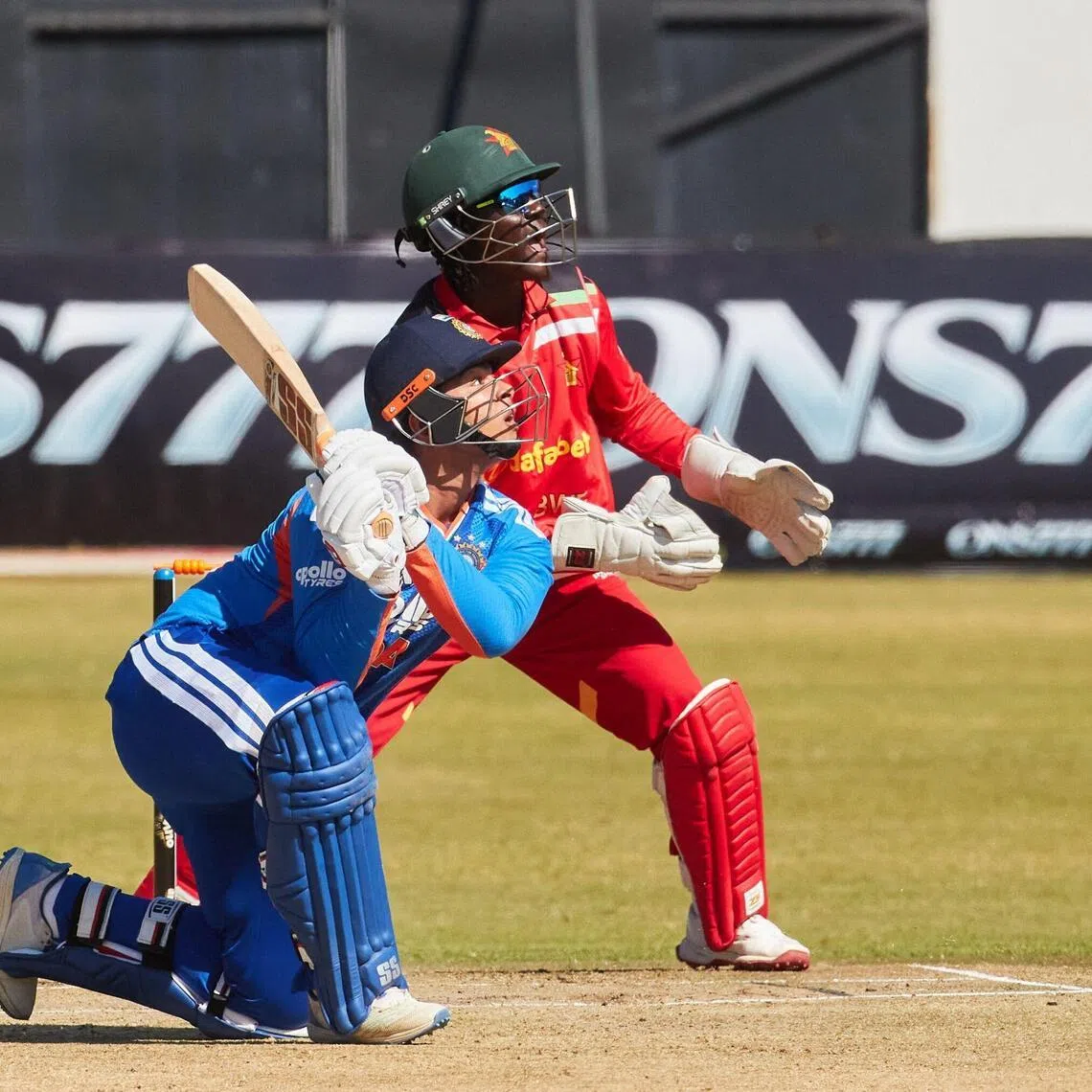 India's Vaibhav Sooryavanshi watches the ball after playing a shot during the third Twenty20 international cricket match between Zimbabwe and India at Harare Sports Club in Harare, on July 26, 2026. (Photo by Jekesai NJIKIZANA / AFP)