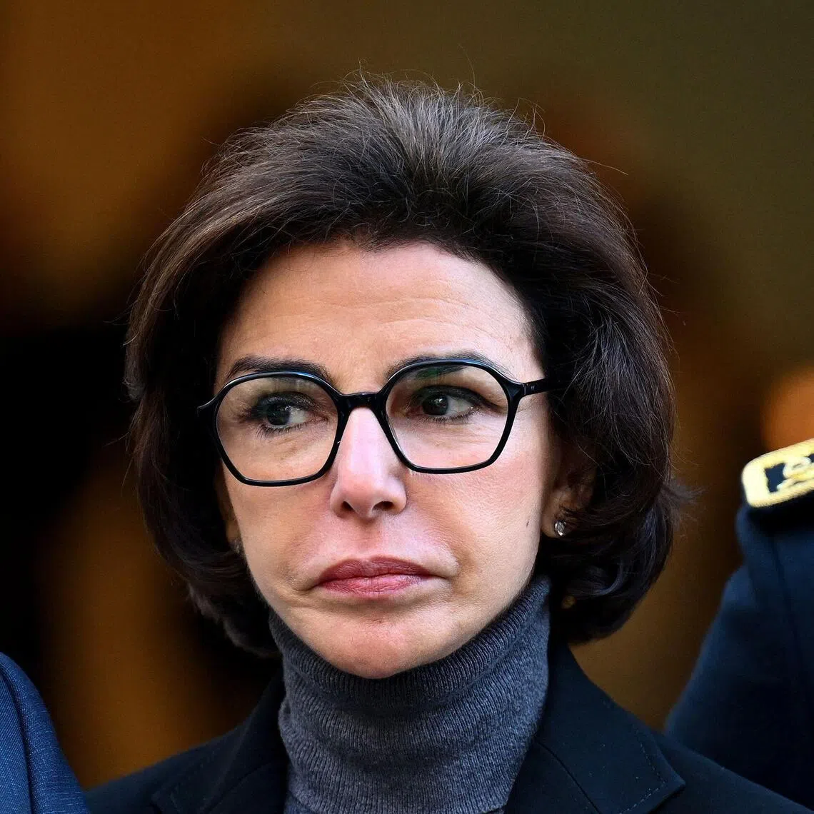 French Culture Minister Rachida Dati looks on as she arrives to take part in the inauguration of the Bonnat-Helleu Museum following 14 years of renovations in Bayonne, southwestern France, on November 26, 2025. Searches were carried out on December 18, 2025 at the home of Rachida Dati, as well as at the town hall of Paris’s 7th arrondissement, which she heads, as part of a corruption investigation, according to a source close to the case cited by AFP. (Photo by Gaizka IROZ / AFP)