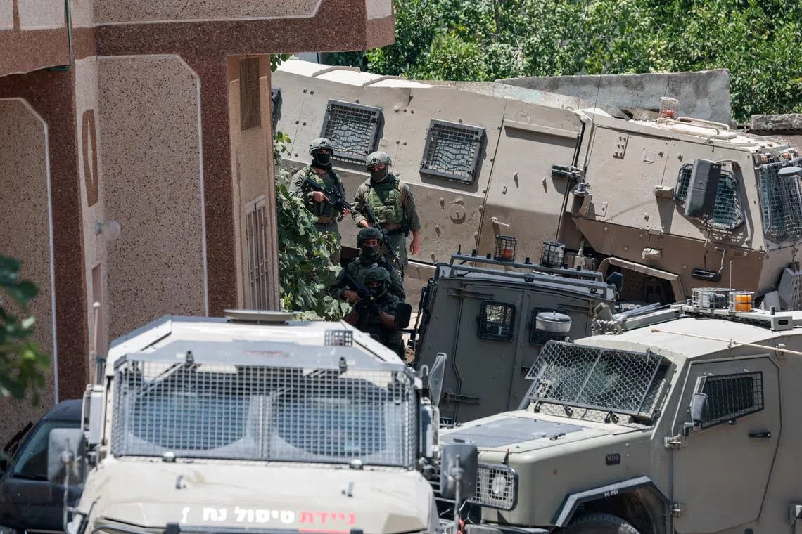 Members of the Israeli forces take part in a raid in Tal, near Nablus, the day after four Palestinians and two Israeli soldiers were killed in a shooting incident, in the Israeli-occupied West Bank, July 25, 2026. REUTERS/Mohammed Torokman