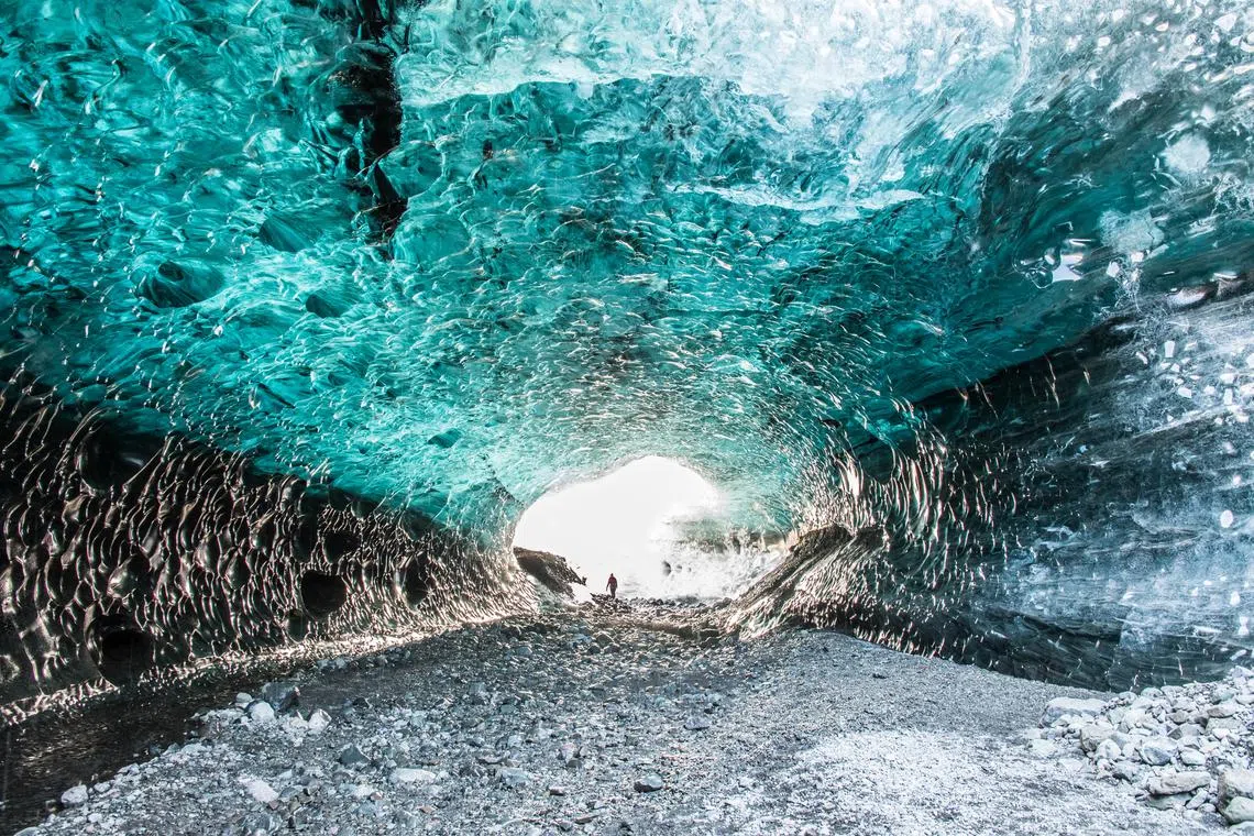A group of tourists were exploring ice caves and canyons on the glacier, Breidamerkurjokull, when the side of an ice canyon gave way.