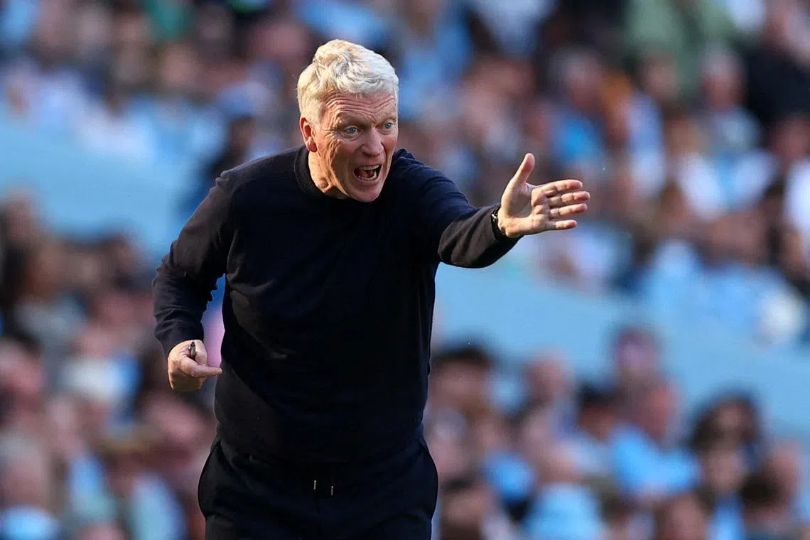 FILE PHOTO: Soccer Football - Premier League - Manchester City v West Ham United - Etihad Stadium, Manchester, Britain - May 19, 2024  West Ham United manager David Moyes reacts REUTERS/Molly Darlington/ File Photo