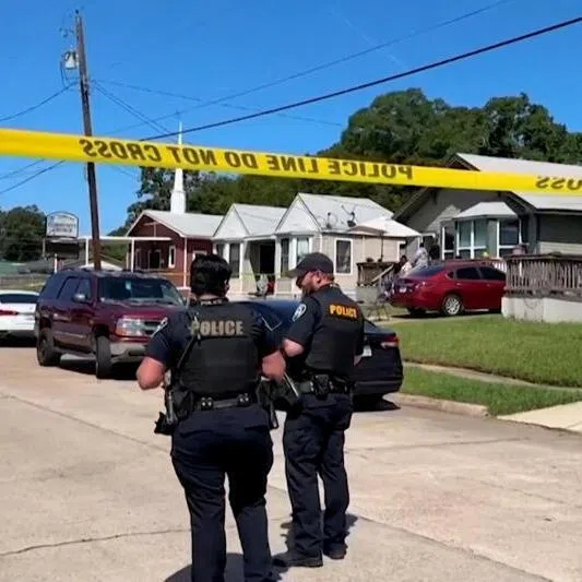 Police officers secure a street where eight children, with ages ranging from 1 to 14, were killed in a mass shooting in Shreveport, Louisiana, on April 19, 2026.